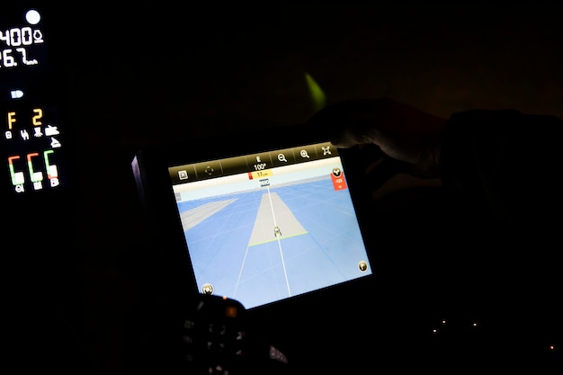 Navigation monitor on a special tractor for treating fields from weeds.