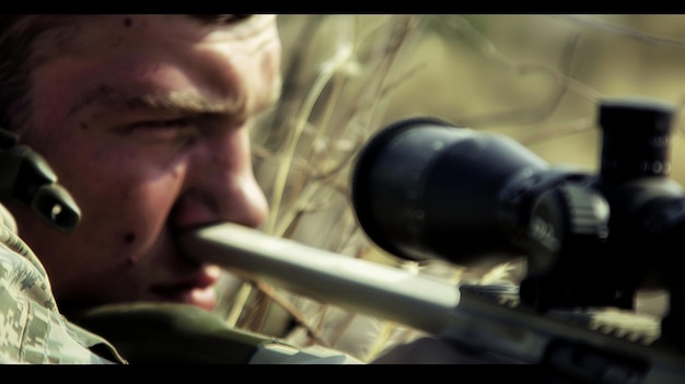 Photo navy sniper in a concealed position focused target