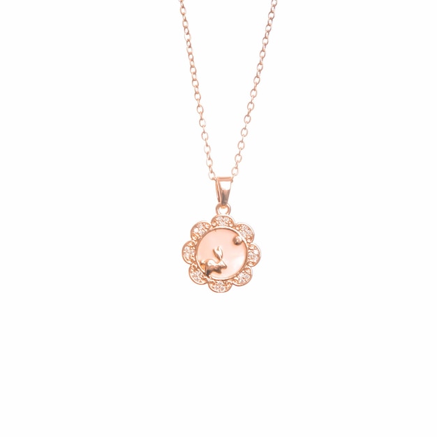 A necklace with a gold flower pendant.