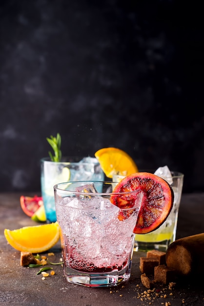 Negroni cocktail on dark stone table.