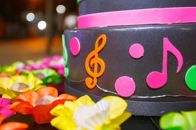 Neonthemed cake with musical icons at a party in Rio de Janeiro