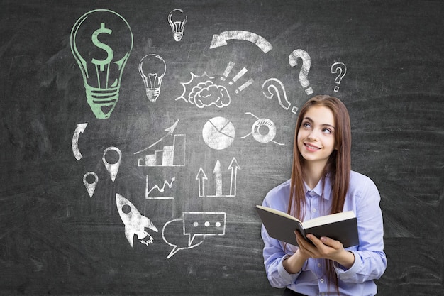 Nerdy girl with a book and green dollar light bulb