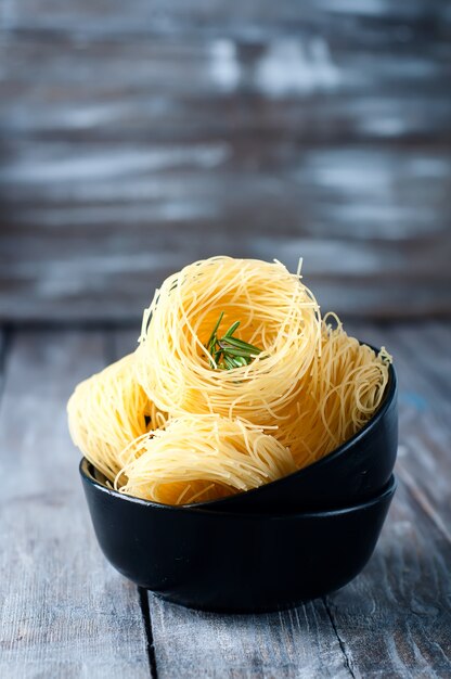 nest of pasta into a bowl