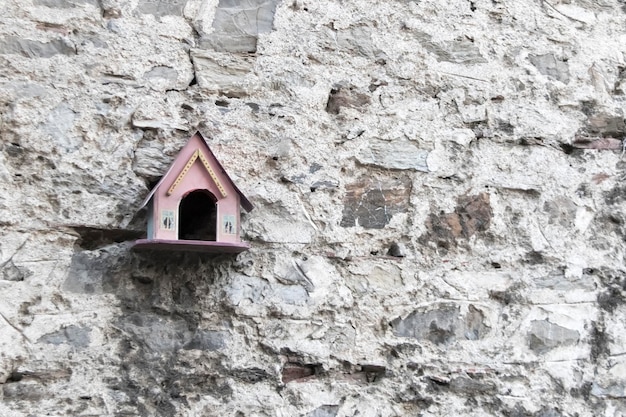 Nesting box on stone wall