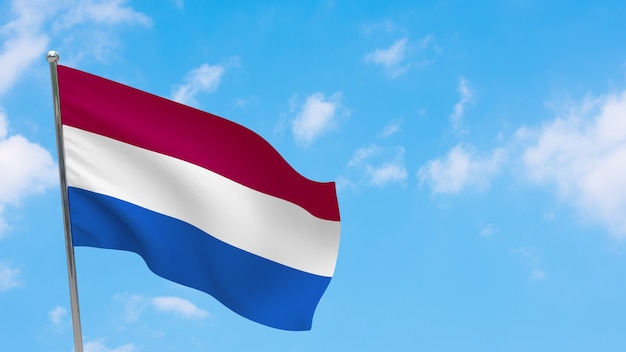 Netherlands flag on pole. Blue sky. National flag of Netherlands