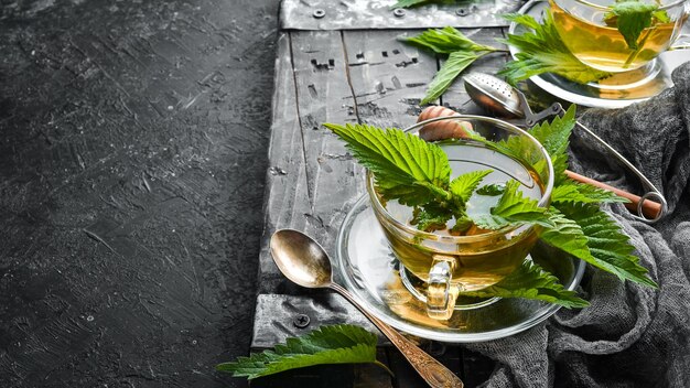 Photo nettle tea in cups. immunostimulating herbal drinks. top view. free space for your text.