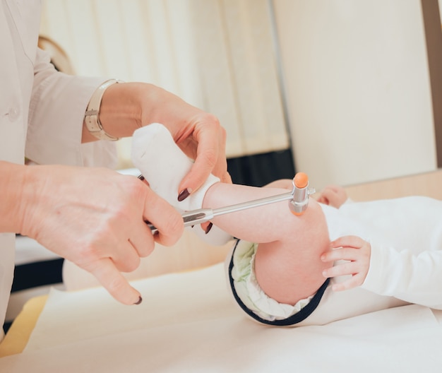 Neurologist diagnosing little boy. Pediatric