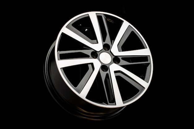 New alloy wheels on a black background. stylish and beautiful. auto parts and auto tuning.