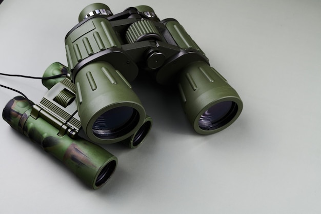 New binoculars isolated on white background Flat lay top view