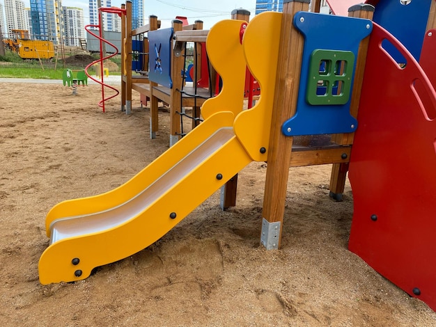 New bright children's playground in the courtyard of the new building