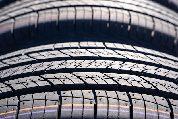 New car summer tires in a row Car tire tread closeup