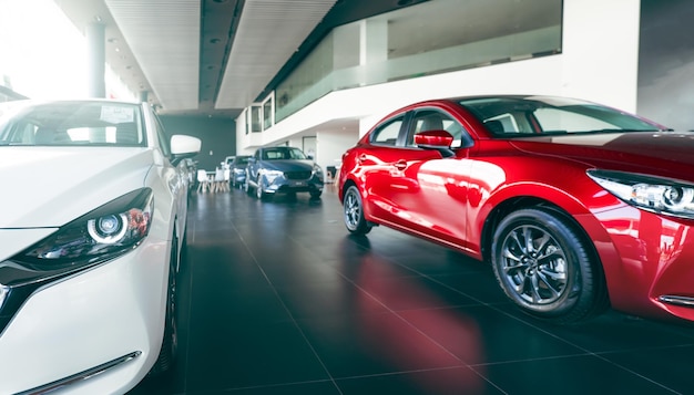 New cars parked in luxury showroom Car dealership office Car parked in showroom with care Car