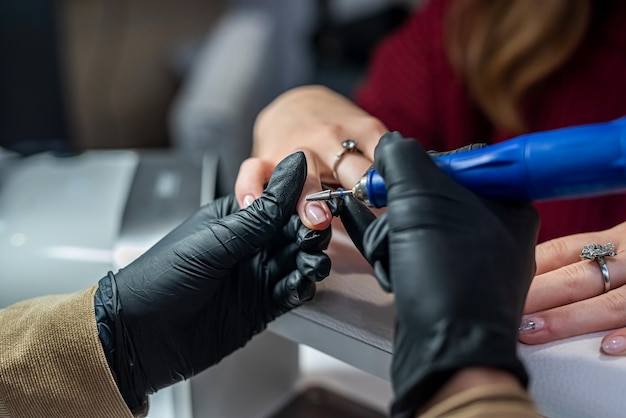 A new client came to a qualified nail artist to do a new manicure during quarantine