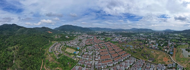 New development real estate Aerial view of residential houses and driveways neighborhood during day timeTightly packed homesPanorama view over private houses in phuket thailand