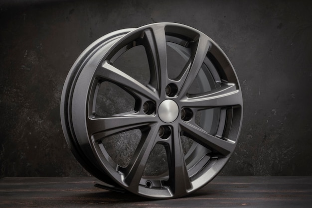 New grey allonew grey alloy wheels on a dark textured black background