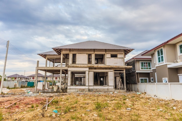 New house under construction at building site