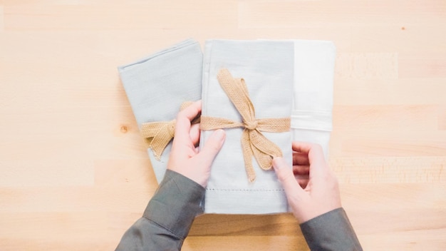 Photo new linen dinner napkin on wood table.