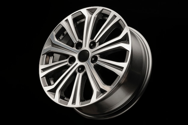 New modern alloy wheel with grey inserts, side view.