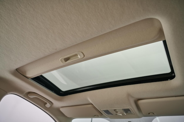 A New modern car inside view of sunroof Image