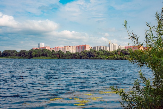 New modern residential area near the lake on summer day