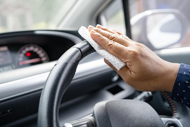 New Normal Asian working woman clean in car for protect safety Coronavirus