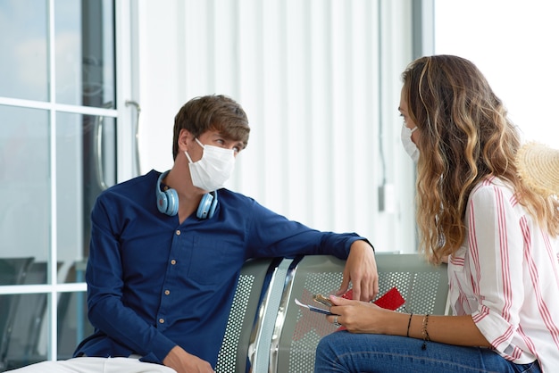 New normal couple traveling with mask