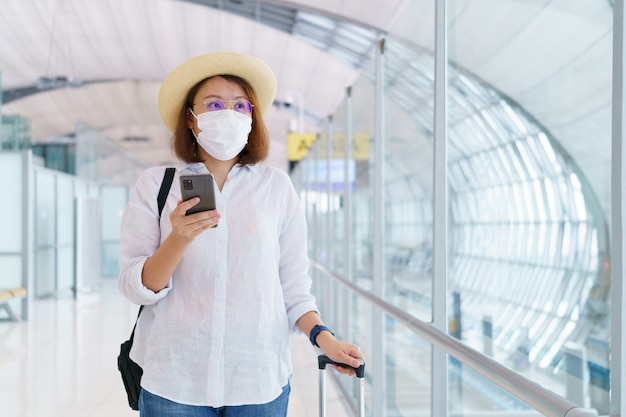 New Normal tourist wearing face mask is traveling on The airport