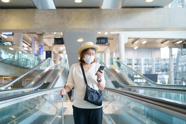 New Normal tourist wearing face mask is traveling on The airport