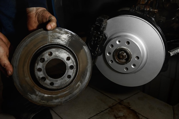 Photo new and old front brake disks for modern car