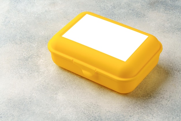 New plastic lunch box on a gray background