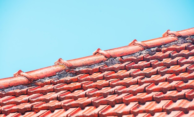 New roofing construction with roof windows and roof protection and blue sky.