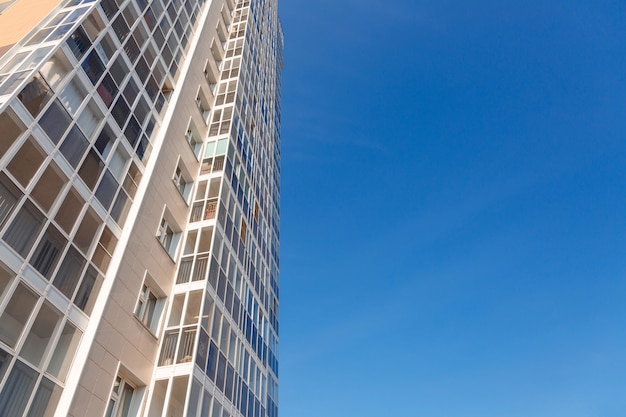 New tall house on a background of blue sky