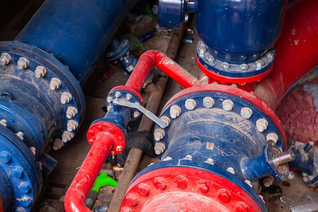 New underground plumbing system made of steel pipes and valves painted red and blue