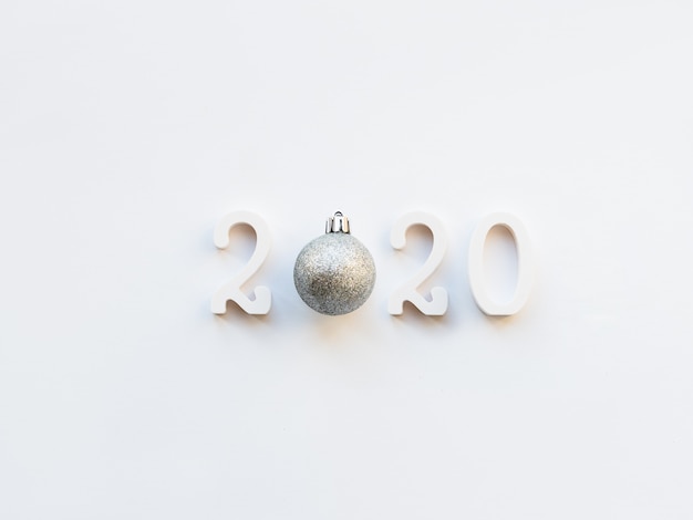 Photo new year 2020 background with silver ball