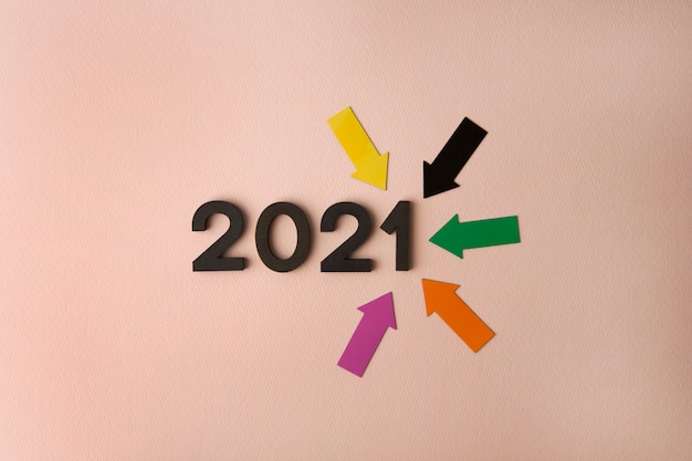 New Year 2021 with arrows on pink surface