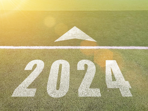 New year 2024 Text 2024 has written on the ground Straight forward concept Keep going to the goal