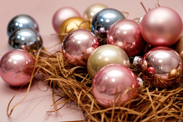 New Year background postcard New Year colorful balls on a pink background