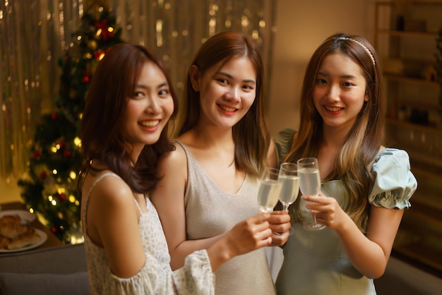 New Year celebration concept Young beautiful group clinking champagne to celebrating in party