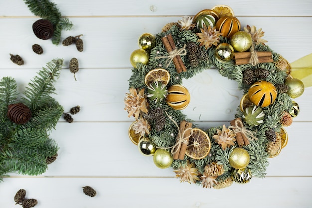 New year christmas decoration with spices, cinnamon, mandarin, eve on white wooden background