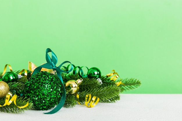 New Year Christmas tree toy branches of a christmas tree New Year decorations on a colored background