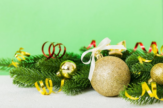 New Year Christmas tree toy branches of a christmas tree New Year decorations on a colored background