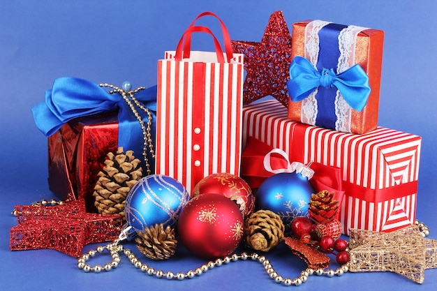 New Year composition of New Year's decor and gifts on blue background