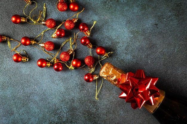 New Year composition with golden champagne bottle and christmas decor. New Year Flatly. Christmas flatlay. New year 2022. New year concept