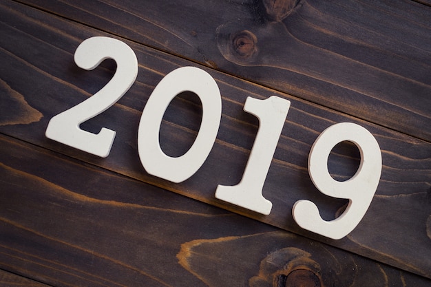 New year concept - Number 2019 for New Year on a wooden table.