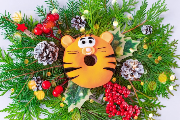 New Year food tiger 2022 Cute donuts tiger for on a background of decorations Chinese New Year