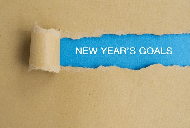 New Year Goals text on torn paper