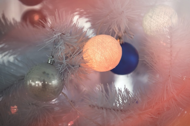 New Year's background - Christmas tree decorated with garlands, close-up.