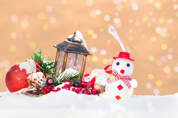 New Year's Christmas decoration postcard, snowman, spruce branch, red ball and New Year's lantern