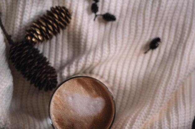 New Year's cup of coffee on a white knitted blanket