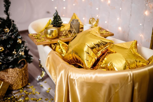 New Year's decoration of the room in golden color The concept of the holiday and festive design Home decor for the New Year